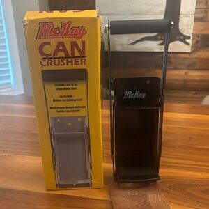 McKay Wall Mounted Can Crusher in Black includes bottle opening function